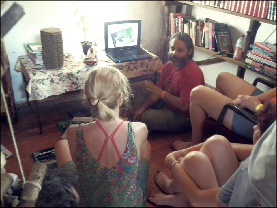 Permaculture design documentation being prepared and reviewed on a laptop